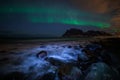 Winter landscape with Aurora Borealis and full moon  in Lofoten archipelago , Norway northern light s Royalty Free Stock Photo