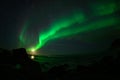 Winter landscape with Aurora Borealis and full moon  in Lofoten archipelago , Norway northern light s Royalty Free Stock Photo