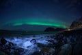 Winter landscape with Aurora Borealis and full moon  in Lofoten archipelago , Norway northern light s Royalty Free Stock Photo