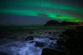 Winter landscape with Aurora Borealis and full moon  in Lofoten archipelago , Norway northern light s Royalty Free Stock Photo