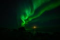 Winter landscape with Aurora Borealis and full moon  in Lofoten archipelago , Norway northern light s Royalty Free Stock Photo