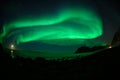 Winter landscape with Aurora Borealis and full moon  in Lofoten archipelago , Norway northern light s Royalty Free Stock Photo