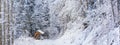 Winter landscape, banner - view of the snowy road in the winter mountain forest