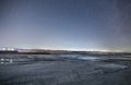 Winter landscape, beautiful frozen lake in night under starry sky. Royalty Free Stock Photo