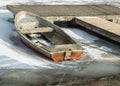 Winter landscape with a boat on the shore of the lake, ice covered lake, Lake Burtnieki Royalty Free Stock Photo