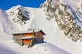 Winter landscape with cabin at Balea Lake and Fagaras Mountains Royalty Free Stock Photo