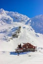 Winter landscape with cabin at Balea Lake and Fagaras Mountains Royalty Free Stock Photo