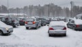 Winter landscape. Cars parking in the snow. Day after freezing .