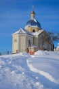 Church in winter on the hill,winter landscape of the church in winter and a trail of snow