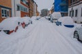 Winter landscape in the city of Braunschweig, Germany. Snow covered street and cars. Winter season with heavy snowfall