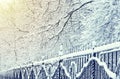 Winter landscape in city park, iron fence in snow
