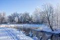 Winter landscape in clear weather. Morning bright sun. Snow plays shine. Frosty Snow Park Royalty Free Stock Photo