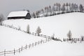 Winter landscape with cottage above the hill Royalty Free Stock Photo