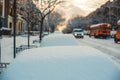 snow covers a street in front of a row of school buses Royalty Free Stock Photo