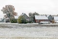 Winter landscape with first snow in the countryside fields with late autumn colors Royalty Free Stock Photo