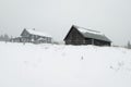 Winter landscape. Foggy day in a small mountain village. Royalty Free Stock Photo