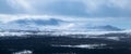 Winter landscape with foggy snowy mountains. Panorama Royalty Free Stock Photo