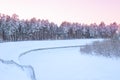 Winter landscape in the forest on the banks of a snowy river Royalty Free Stock Photo