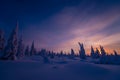 Winter landscape with forest, cloudy sky and sun Royalty Free Stock Photo