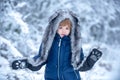 Winter landscape of forest and snow with cute child boy. Children run on snowy field. Boy dreams of winter time. Happy Royalty Free Stock Photo