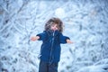 Winter landscape of forest and snow with cute child boy. Enjoying nature wintertime. Happy winter time. Well dressed Royalty Free Stock Photo