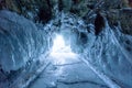 Winter Landscape, Frozen ice cave with bright sunlight from way out at frozen lake Baikal in Siberia, Russia Royalty Free Stock Photo