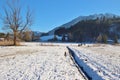 Winter landscape with frozen lake in Goldegg, Austria.