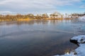 Winter landscape at frozen lake with polynya in foreground Royalty Free Stock Photo