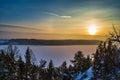 Winter Landscape with Frozen Lake Shore on a Sunset