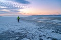 Winter landscape with frozen lake and sunset sky Royalty Free Stock Photo