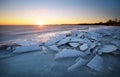 Winter landscape with frozen lake and sunset sky. Royalty Free Stock Photo