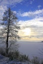 Winter landscape with frozen lake surface and woods in Masuria lakes district in Poland - Lasmiady lake near town of Elk Royalty Free Stock Photo