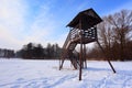 Winter landscape with frozen lake surface and woods in Raszyn ponds near Warsaw in Poland - observatory platform