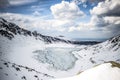 Winter landscape of frozen mountaind pond, Czarny staw gÃâ¦sienicowy, Tatry mountains. Beautiful sunny day, horizontal