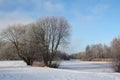 Winter landscape with frozen river and trees covered with snow Royalty Free Stock Photo