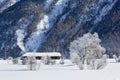 Winter landscape with frozen trees and snow-covered houses