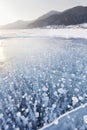 Winter landscape. Gas bubbles in ice of Baikal lake. Royalty Free Stock Photo