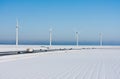 Winter landscape with highway and windturbines