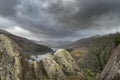 Winter landscape image of the view from Crimpiau and The Pinnacles towards Llynnau Mymbyr and snowcapped Snowdon in the distance