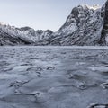 Winter landscape on a lake during Lofoten winter. Snow and ice melting Royalty Free Stock Photo
