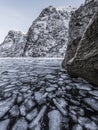 Winter landscape on a lake during Lofoten winter. Snow and ice melting Royalty Free Stock Photo