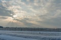 Winter landscape with landing aircraft