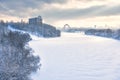 Winter landscape in Moscow, Russia. Scenery of Moskva River covered ice and snow in sunlight. Panoramic view of frozen river for Royalty Free Stock Photo