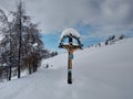 Winter landscape mountain peak the village of Parva, Romania Transylvania. Orthodox crucifix Royalty Free Stock Photo