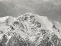 Winter landscape with mountain peaks covered in snow. Beautiful view with Bucegi Mountains part of the Carpathian Mountains, in Royalty Free Stock Photo