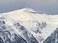 Winter landscape with mountain peaks covered in snow. Beautiful view with Bucegi Mountains part of the Carpathian Mountains, in Royalty Free Stock Photo