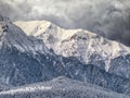 Winter landscape with mountain peaks covered in snow. Beautiful view with Bucegi Mountains part of the Carpathian Mountains, in Royalty Free Stock Photo