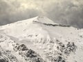 Winter landscape with mountain peaks covered in snow. Beautiful view with Bucegi Mountains part of the Carpathian Mountains, in Royalty Free Stock Photo