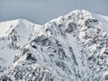 Winter landscape with mountain peaks covered in snow. Beautiful view with Bucegi Mountains part of the Carpathian Mountains, in Royalty Free Stock Photo