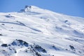 Winter landscape on mountain with ski lift and ski slope.